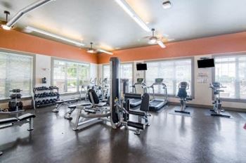 a gym with a lot of exercise equipment